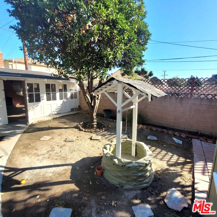 3760 Wellington Road Los Angeles, CA 90016 - Photo 43 of 52 a house with trees in the background