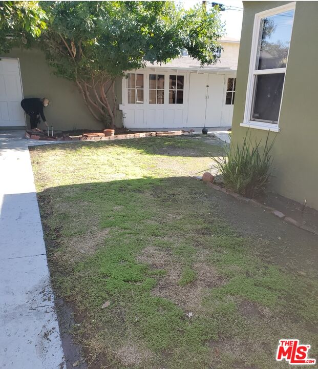 3760 Wellington Road Los Angeles, CA 90016 - Photo 50 of 52 a view of a house with a yard