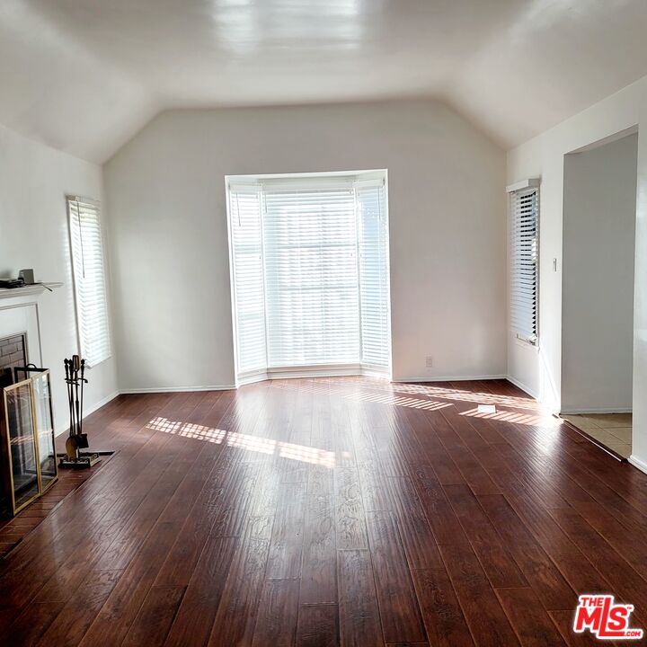 3760 Wellington Road Los Angeles, CA 90016 - Photo 7 of 52 an empty room with wooden floor and windows