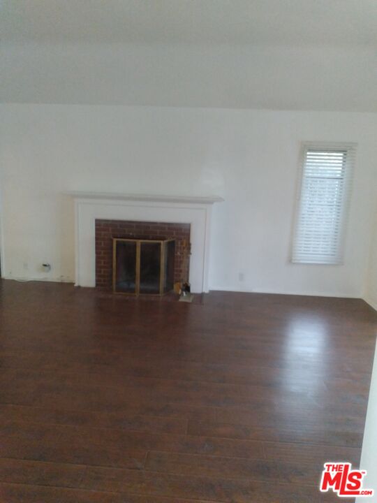 3760 Wellington Road Los Angeles, CA 90016 - Photo 9 of 52 an empty room with a fireplace