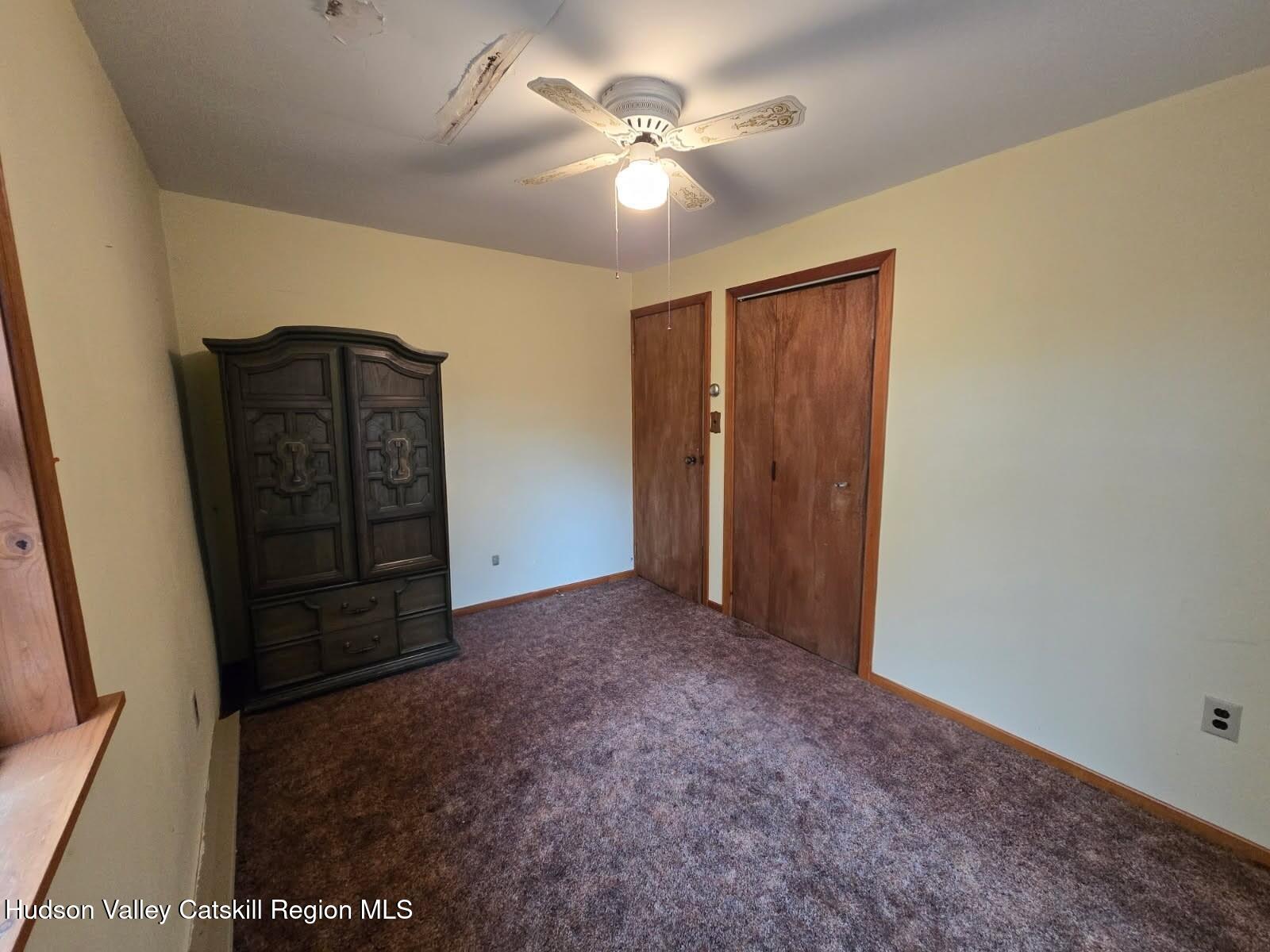 386 Fowler Lake Road Ghent, NY 12075 - Photo 11 of 24 an empty room with closet and cabinet