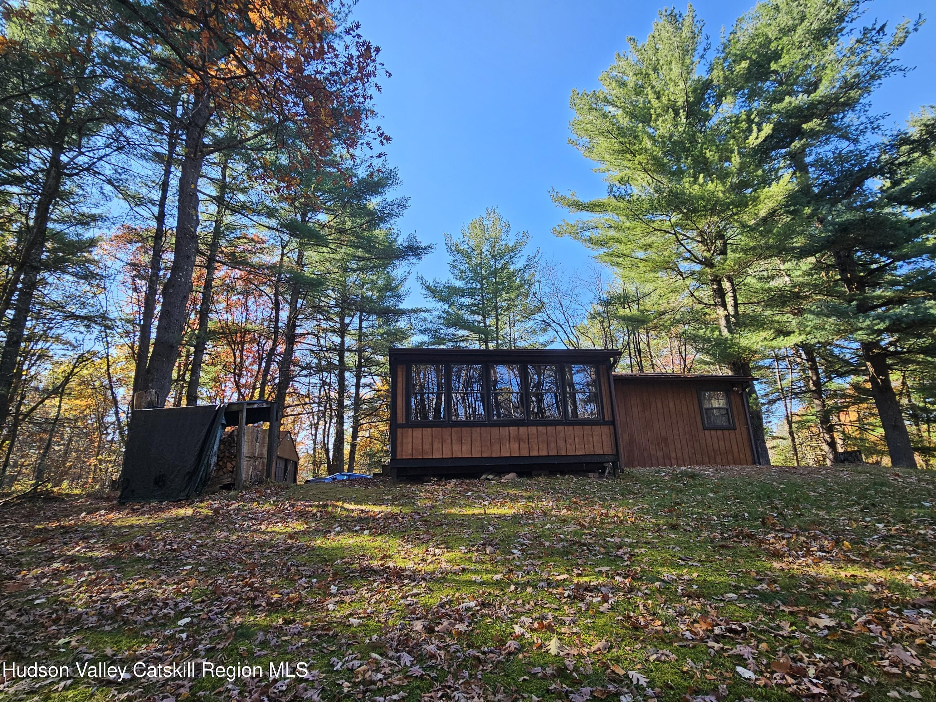 386 Fowler Lake Road Ghent, NY 12075 - Photo 17 of 24 a view of a house with a yard and wooden fence