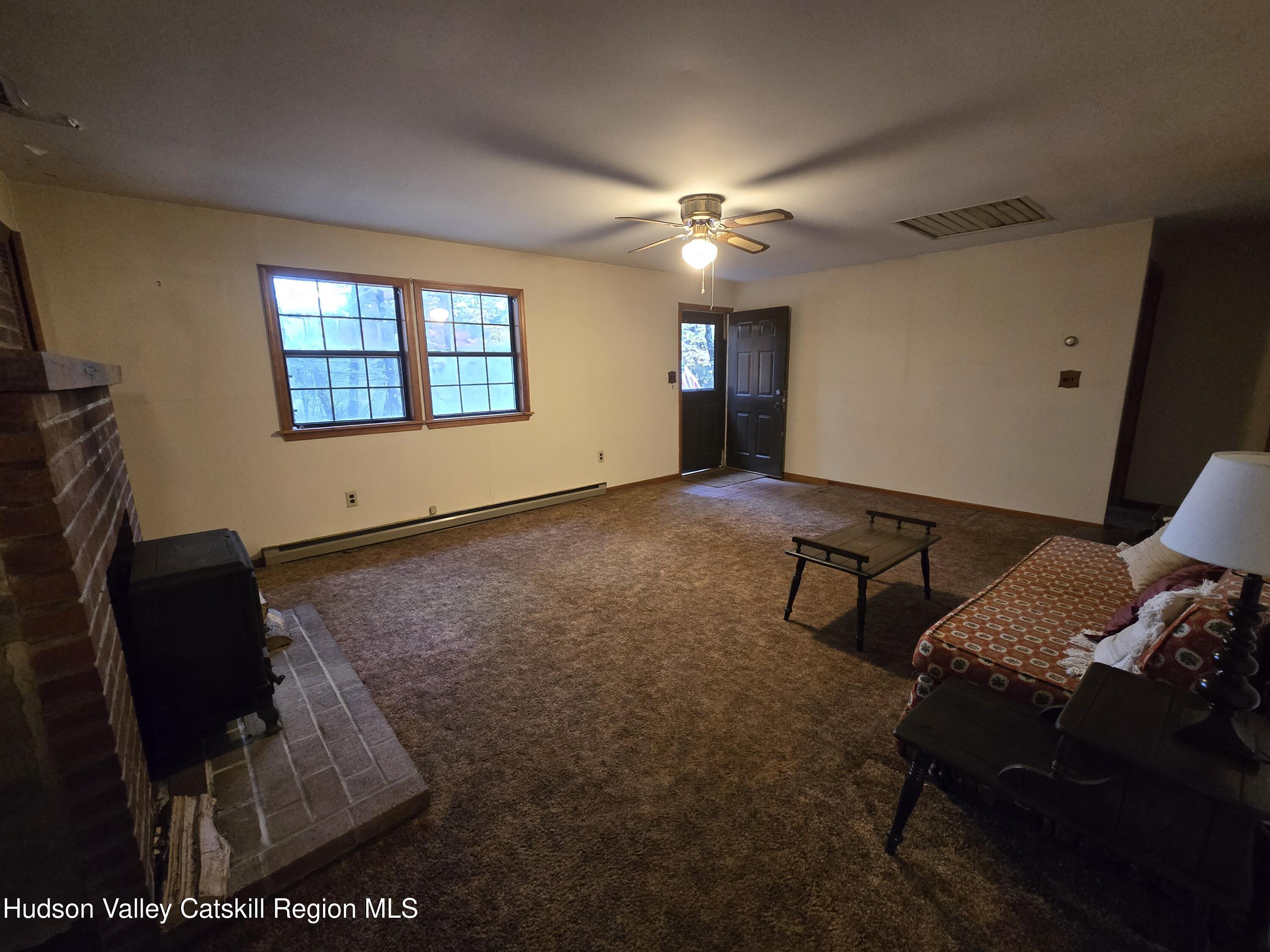 386 Fowler Lake Road Ghent, NY 12075 - Photo 5 of 24 a view of workspace with furniture and ceiling fan