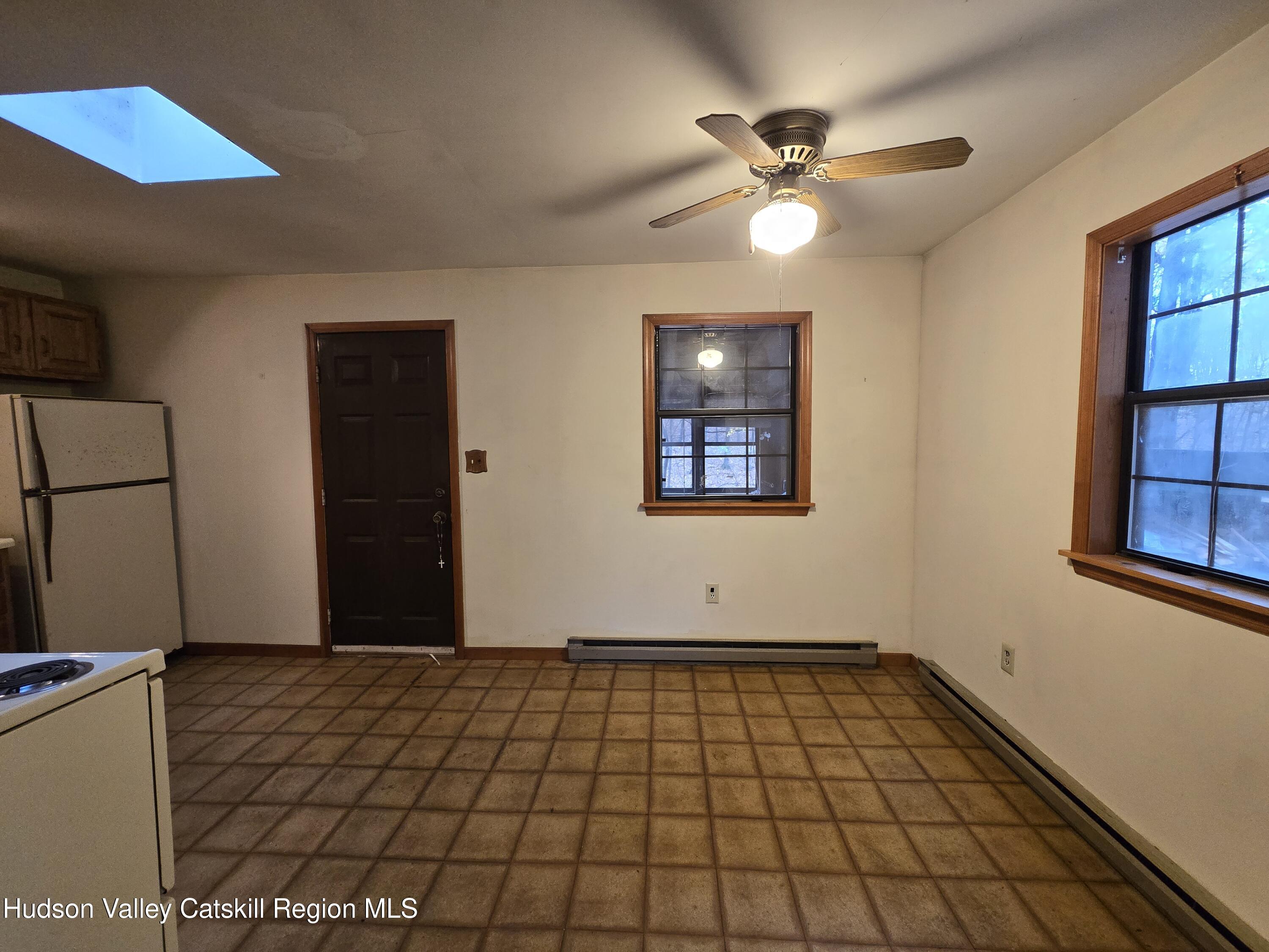 386 Fowler Lake Road Ghent, NY 12075 - Photo 8 of 24 a view of an empty room with a window