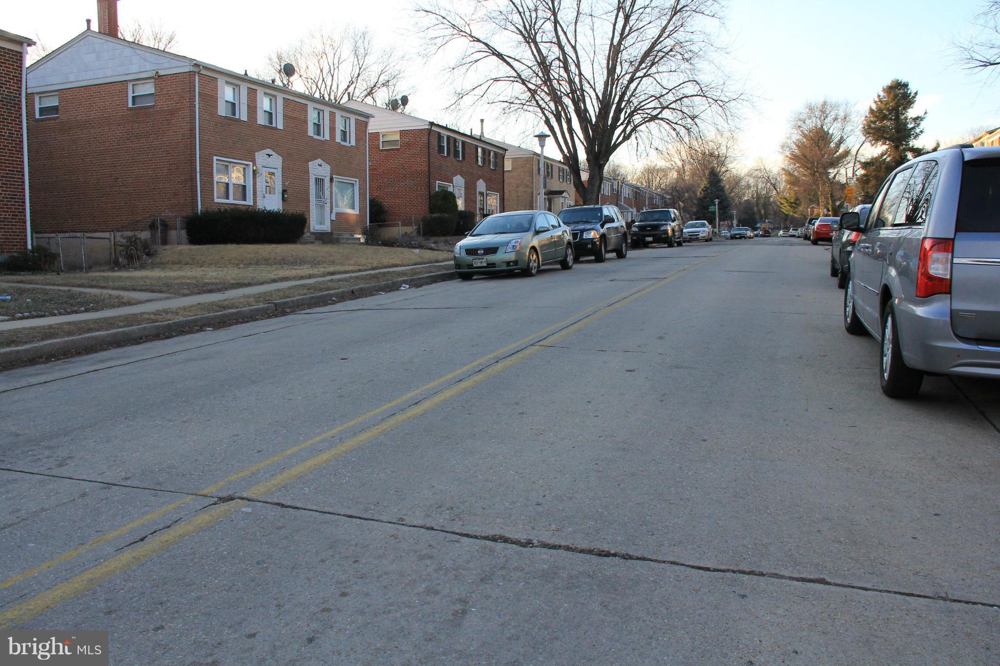 4772 Melbourne Road Baltimore, MD 21229 - Photo 30 of 30 a view of a street with a cars parked in front of it