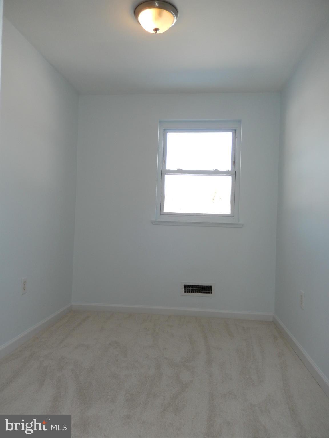 4772 Melbourne Road Baltimore, MD 21229 - Photo 8 of 30 an empty room with a window