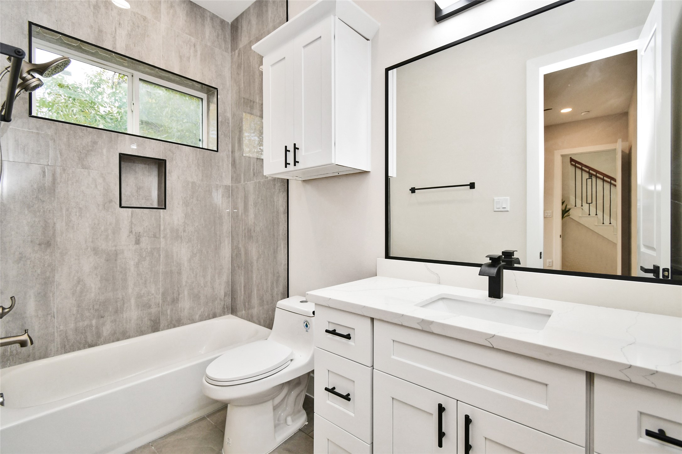 3231 Tuam Street Houston, TX 77004 - Photo 6 of 47 a bathroom with a sink a toilet and shower