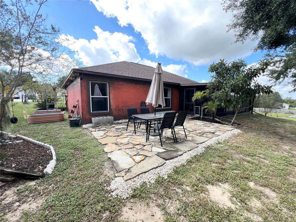 14906 Windy Mt Circle Clermont, FL 34711 - Photo 23 of 26 a view of a house with backyard