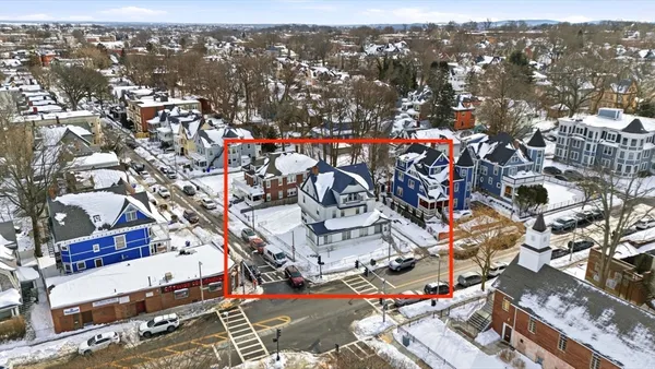 a front view of a house with parking