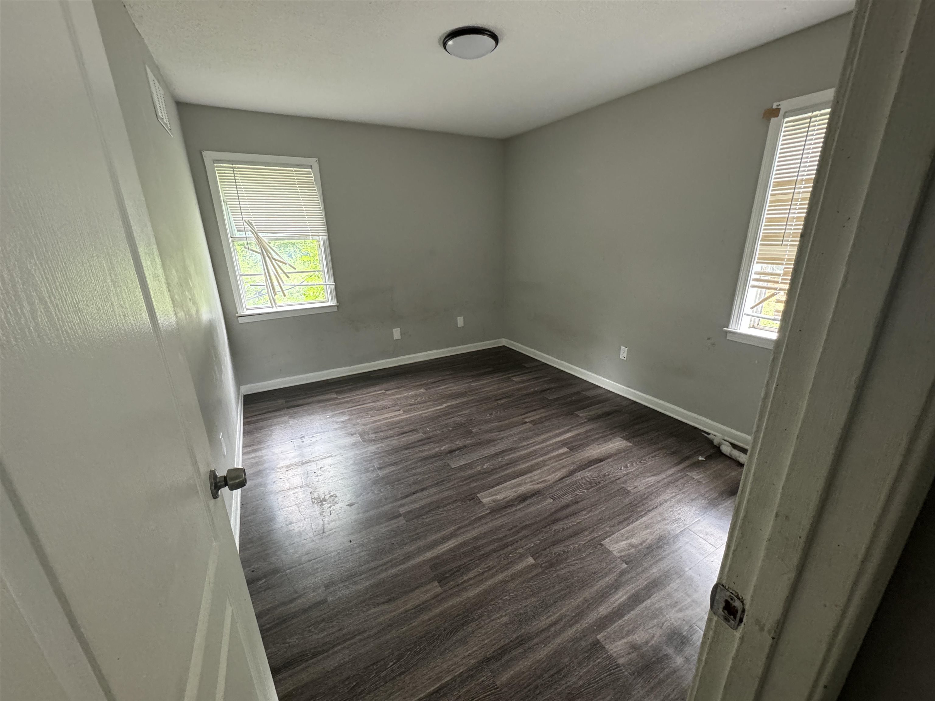 4613 Sumners Wells Road Memphis, TN 38118 - Photo 4 of 6 Spare room with dark hardwood / wood-style flooring