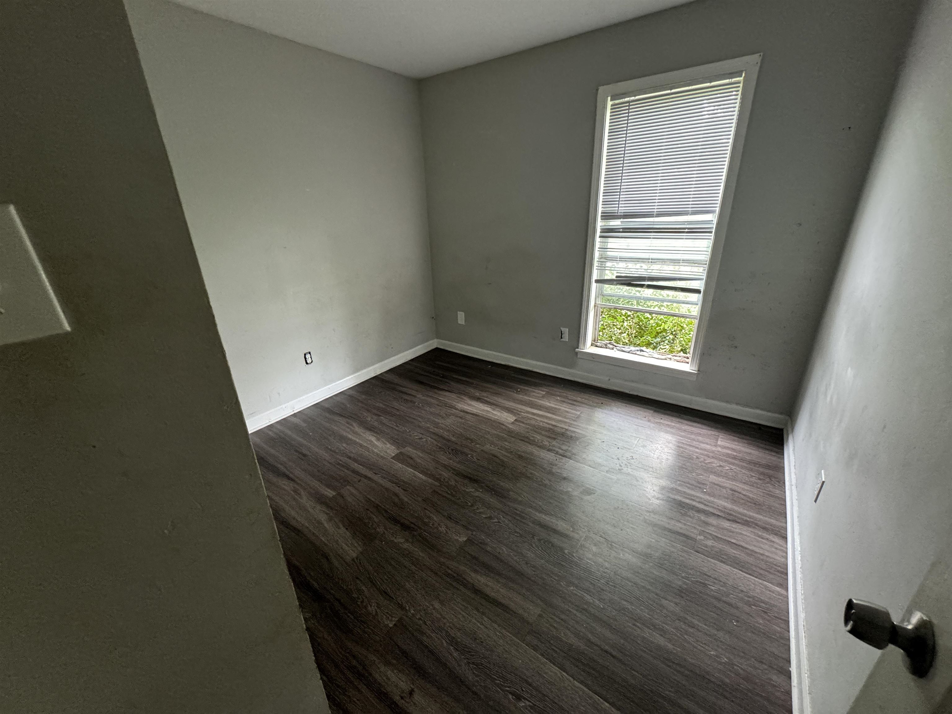 4613 Sumners Wells Road Memphis, TN 38118 - Photo 5 of 6 Unfurnished room featuring dark hardwood / wood-style flooring
