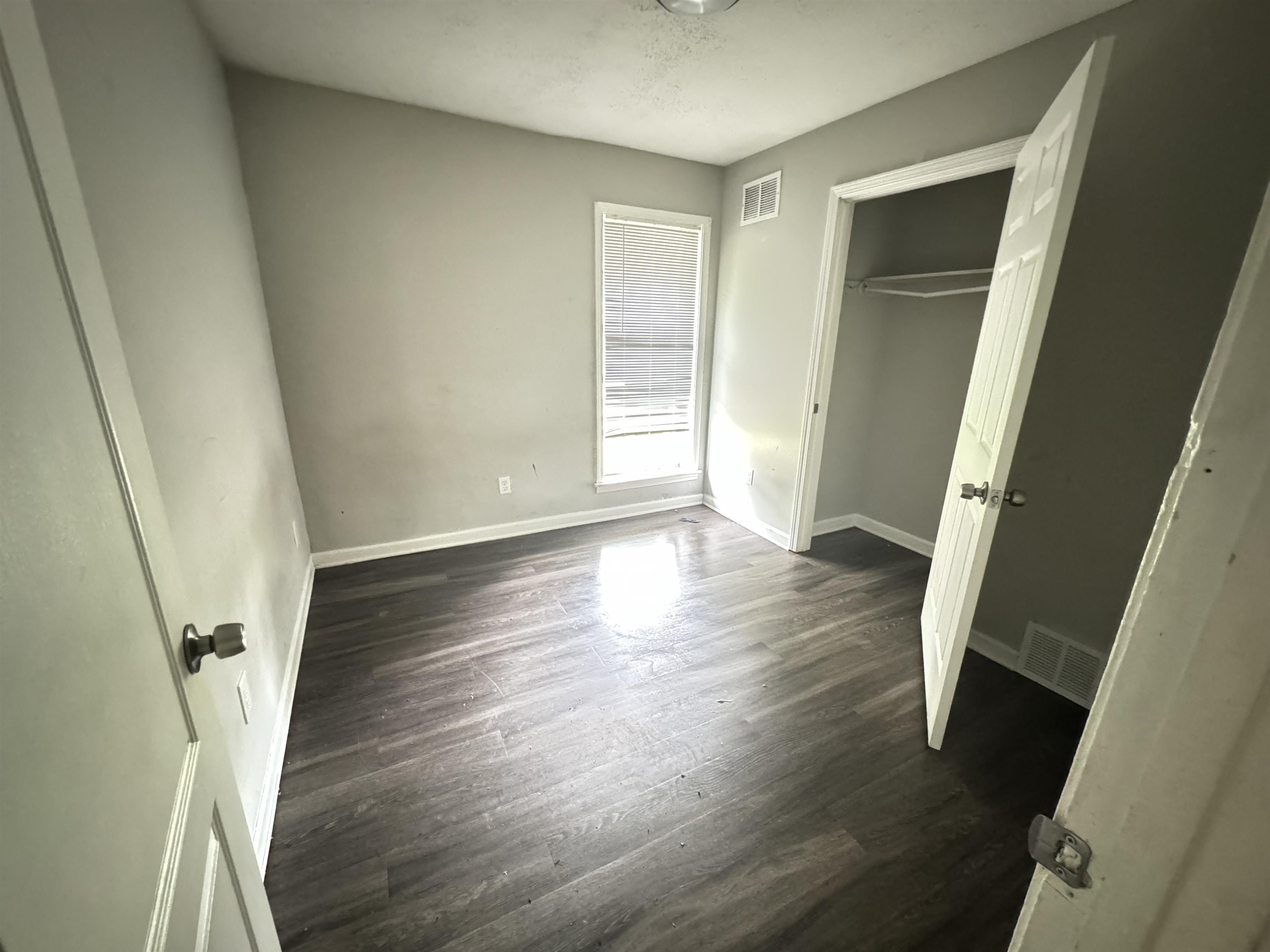 4613 Sumners Wells Road Memphis, TN 38118 - Photo 6 of 6 Unfurnished bedroom featuring a closet and dark hardwood / wood-style flooring