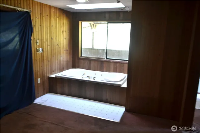 a view of a bathroom with a shower curtain