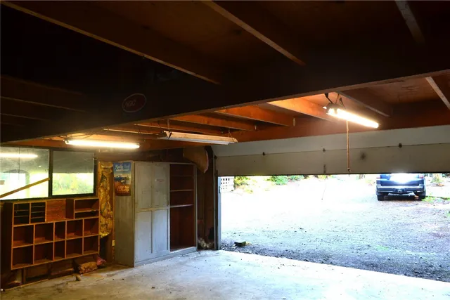 a view of an empty room with a fireplace