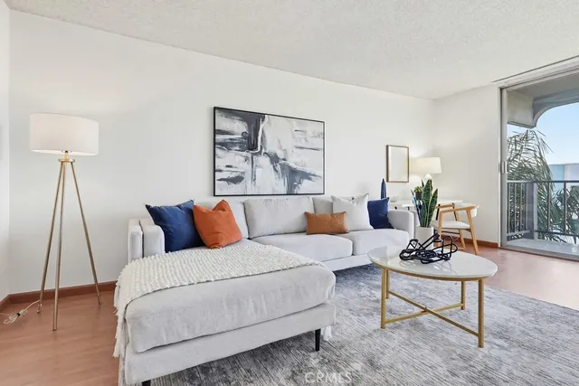 a bedroom with a bed a couch and a window