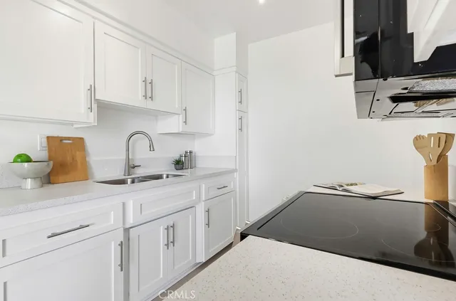 a kitchen with a sink and cabinets