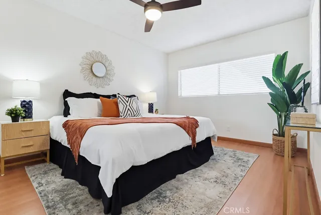 a bedroom with bed and window