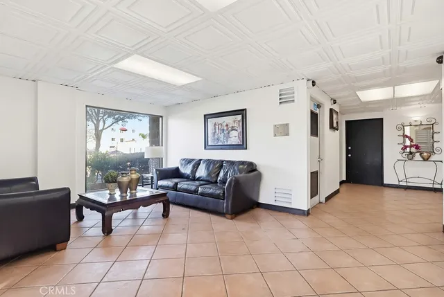 a living room with furniture and a window