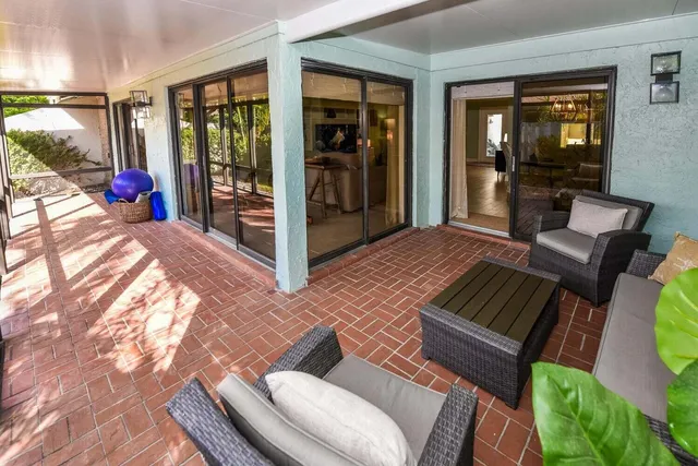 a view of living room filled with furniture