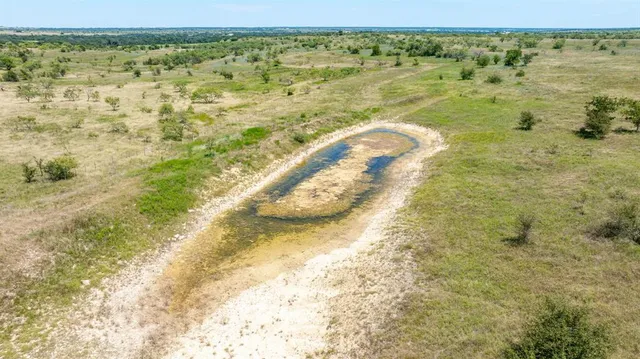 a view of a pool with a building in the background