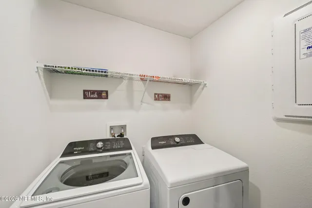 a utility room with dryer and washer