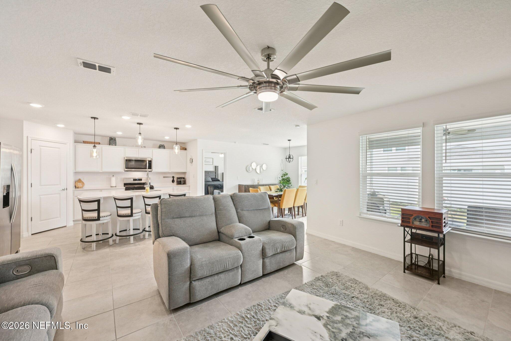 5508 Integrity Way Jacksonville, FL 32244 - Photo 12 of 34 a living room with furniture and a window