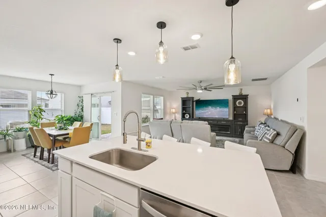 a view of living room with furniture and a flat screen tv