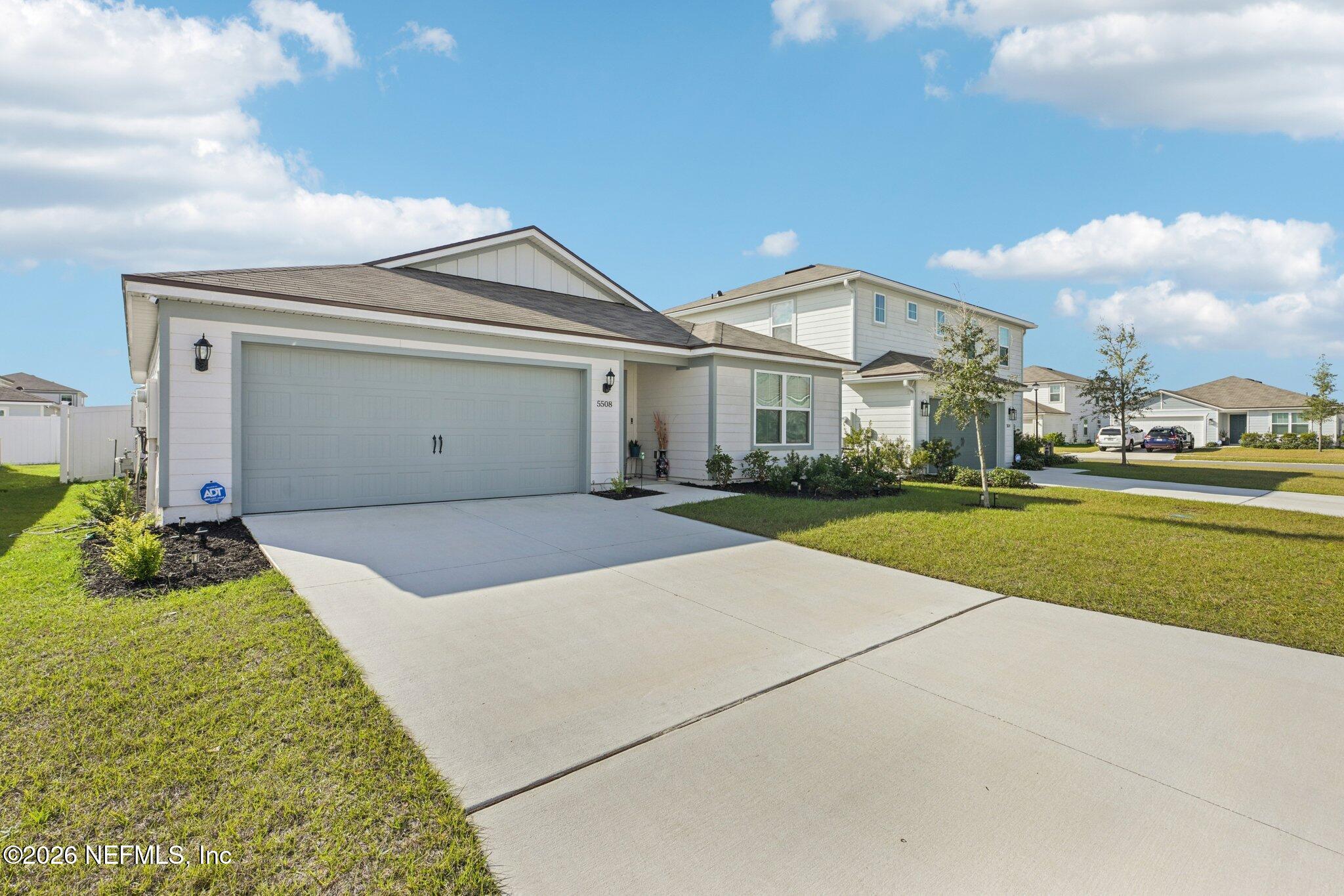 5508 Integrity Way Jacksonville, FL 32244 - Photo 33 of 34 a view of an house with backyard and porch