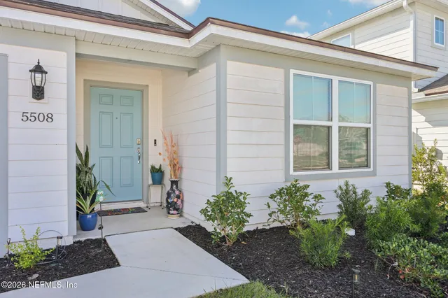 a view of a pathway door of the house