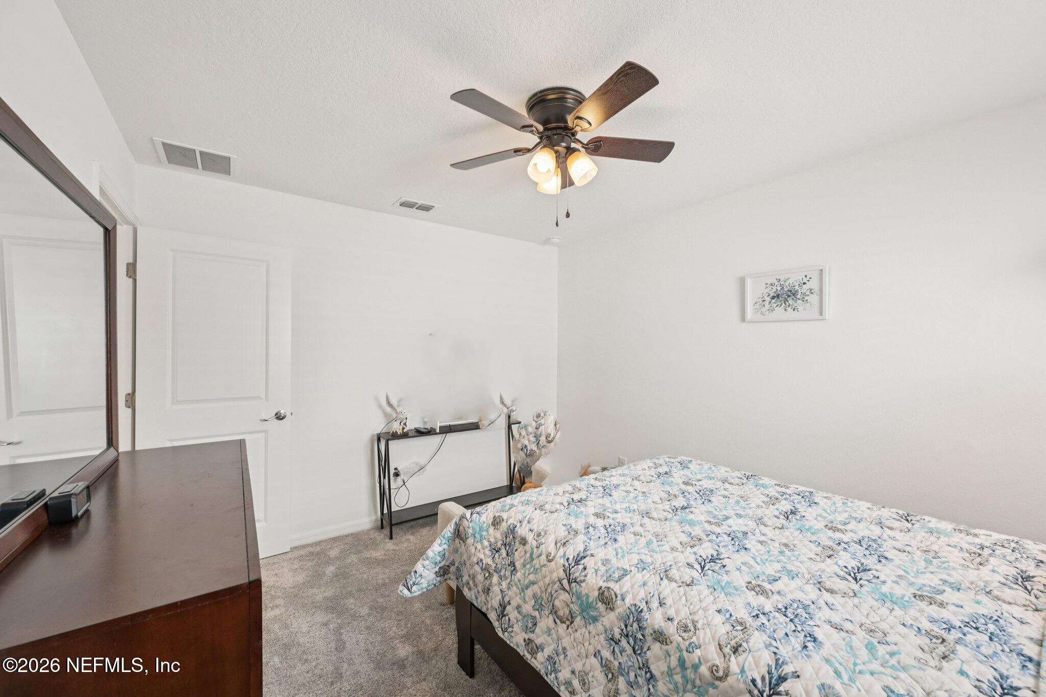 5508 Integrity Way Jacksonville, FL 32244 - Photo 6 of 34 a bedroom with a bed and a flat screen tv