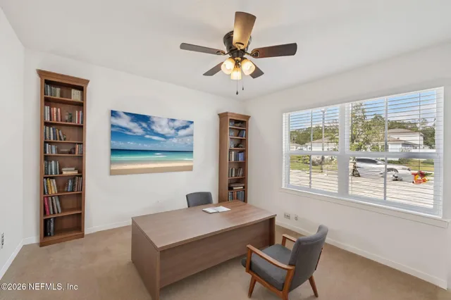 a living room with furniture and window