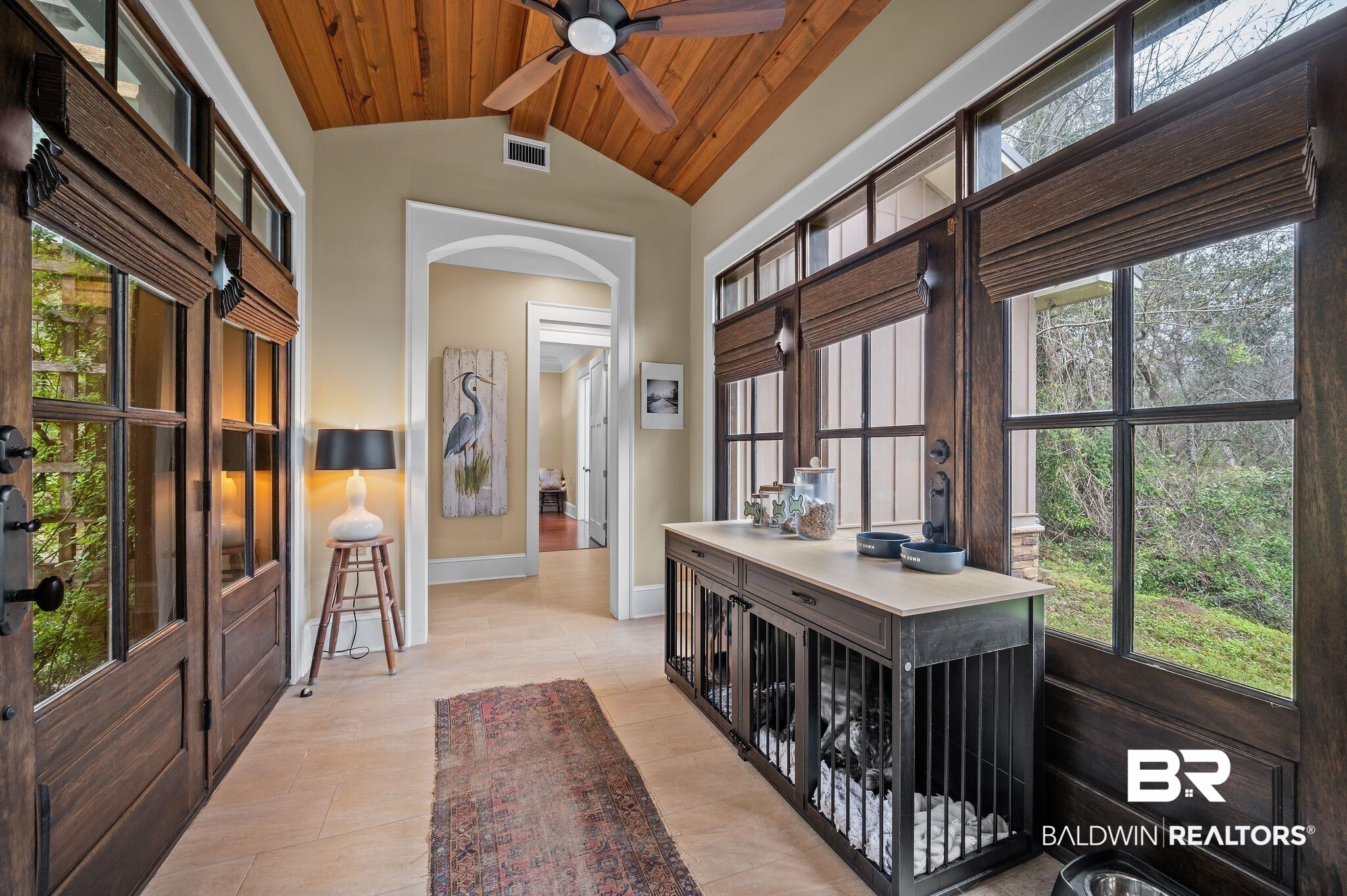 7850 Yorkhaven Road Mobile, AL 36695 - Photo 8 of 57 Interior space with visible vents, baseboards, beamed ceiling, wood ceiling, and arched walkways