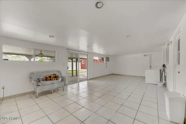 an empty room with shelves and toys