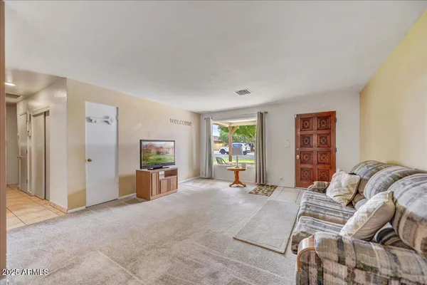 a living room with furniture and a window