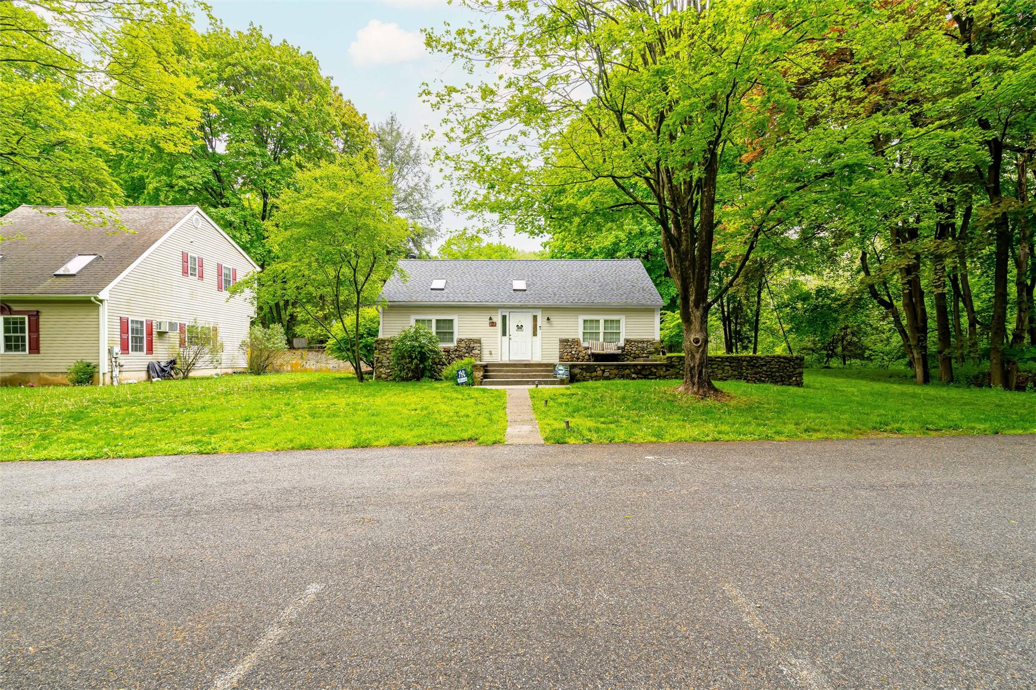 159 Highway 202 Somers, NY 10589 - Photo 11 of 48 a view of a house with a big yard and large trees