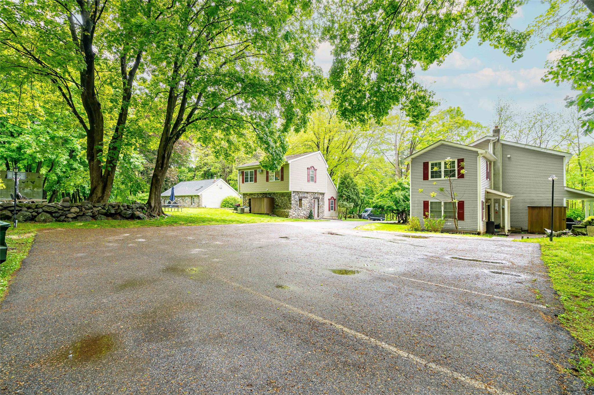 159 Highway 202 Somers, NY 10589 - Photo 16 of 48 a front view of a house with a yard and garage