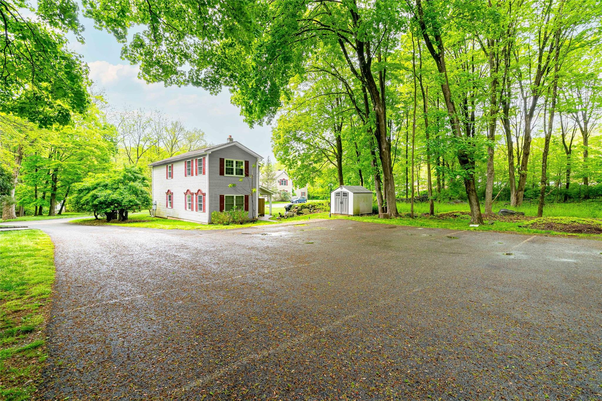 159 Highway 202 Somers, NY 10589 - Photo 17 of 48 a yellow house with trees in front of it