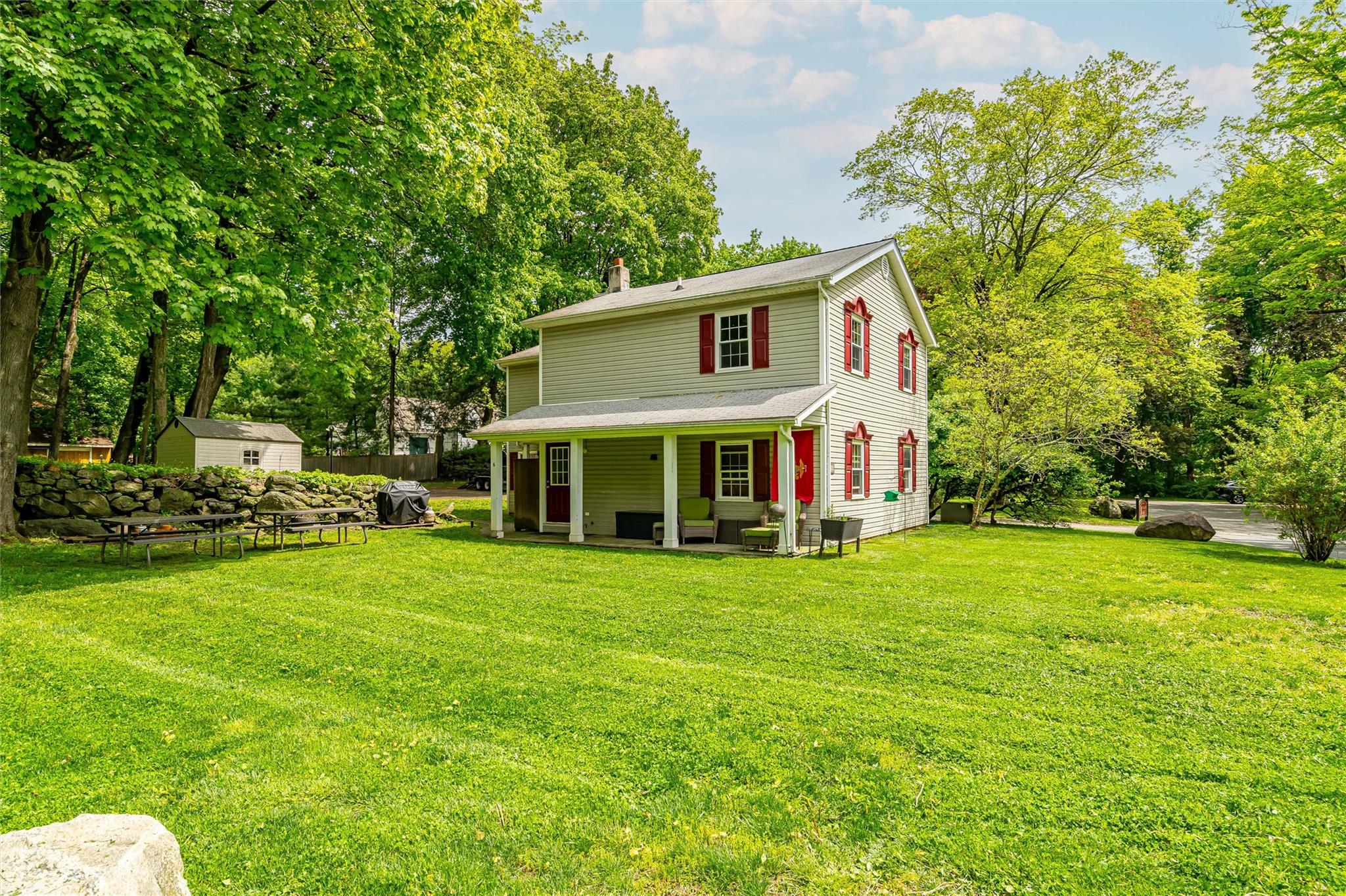 159 Highway 202 Somers, NY 10589 - Photo 25 of 48 a view of a house with a big yard and large trees