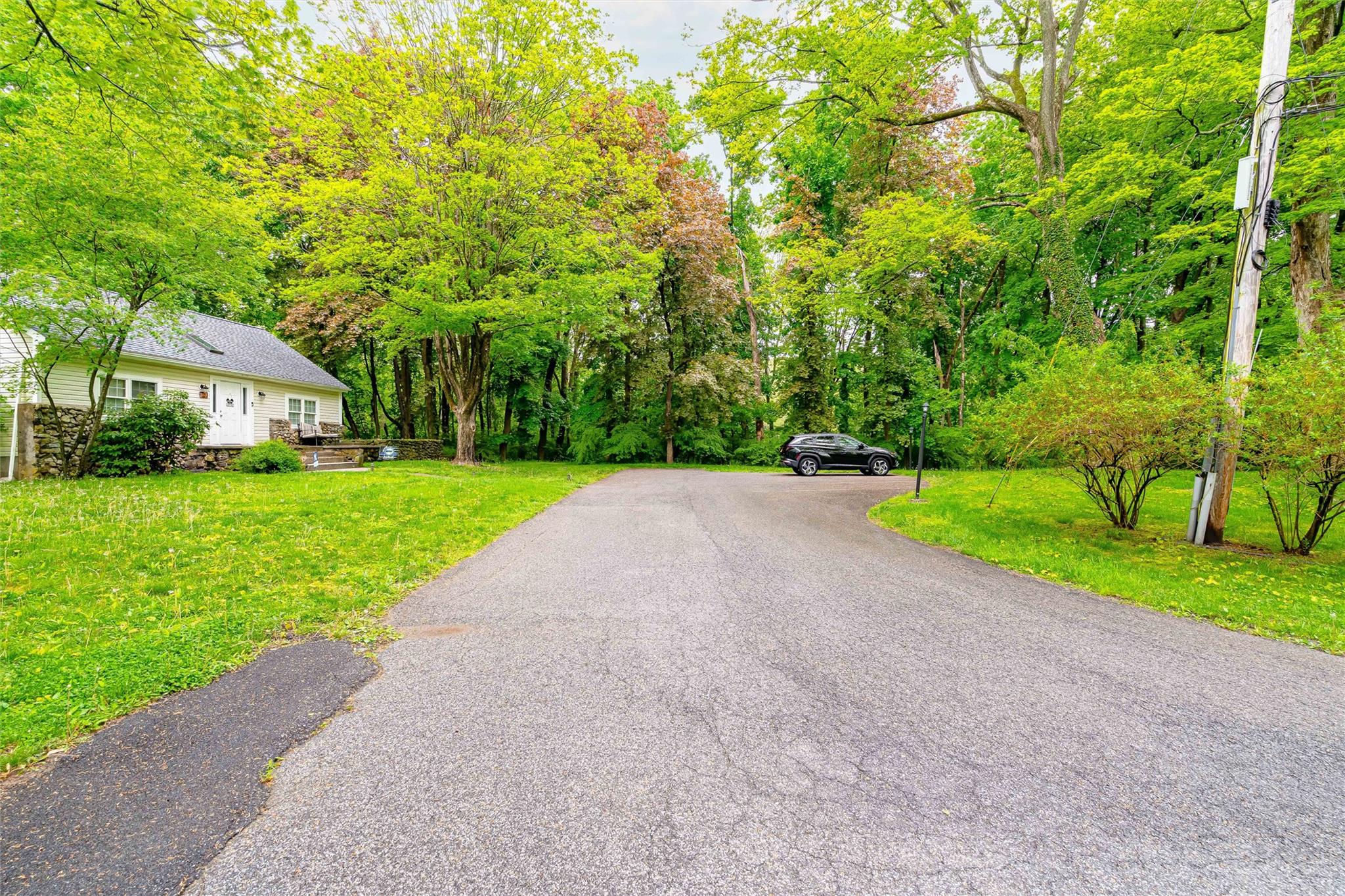 159 Highway 202 Somers, NY 10589 - Photo 8 of 48 a view of a house with a big yard and large trees