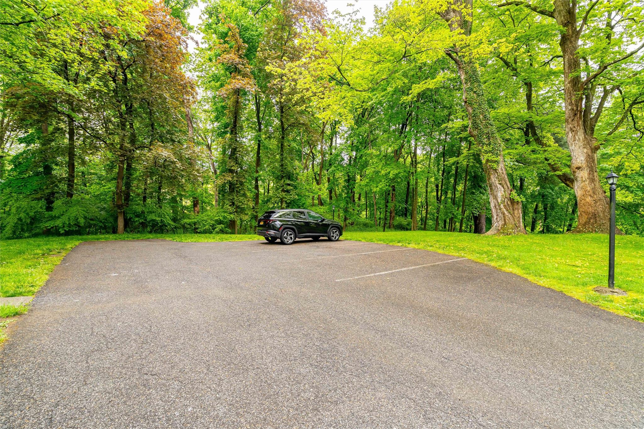 159 Highway 202 Somers, NY 10589 - Photo 9 of 48 a car parked in front of a house with yard