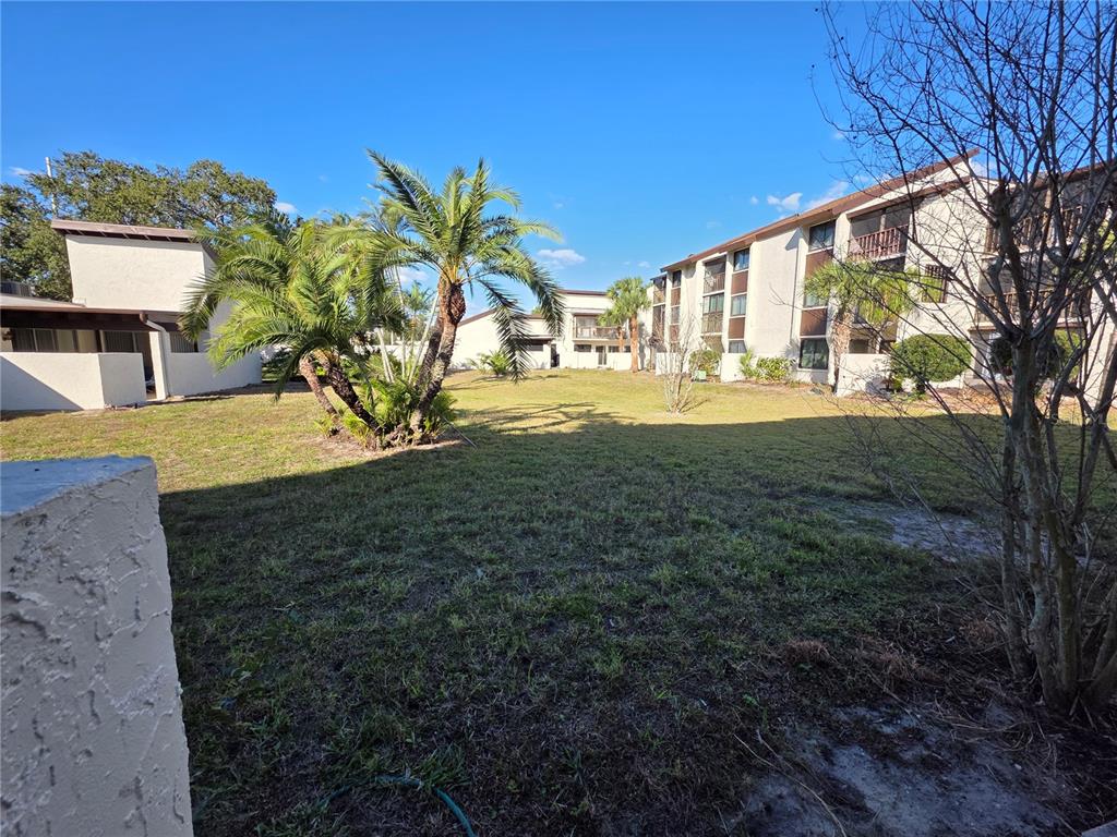 2207 Belleair Road, Unit B6 Clearwater, FL 33764 - Photo 11 of 21 a view of a house with a yard