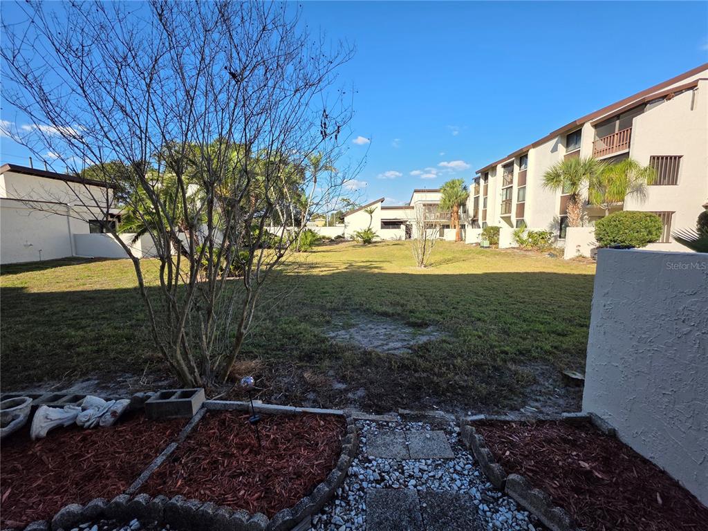 2207 Belleair Road, Unit B6 Clearwater, FL 33764 - Photo 12 of 21 a view of a back yard