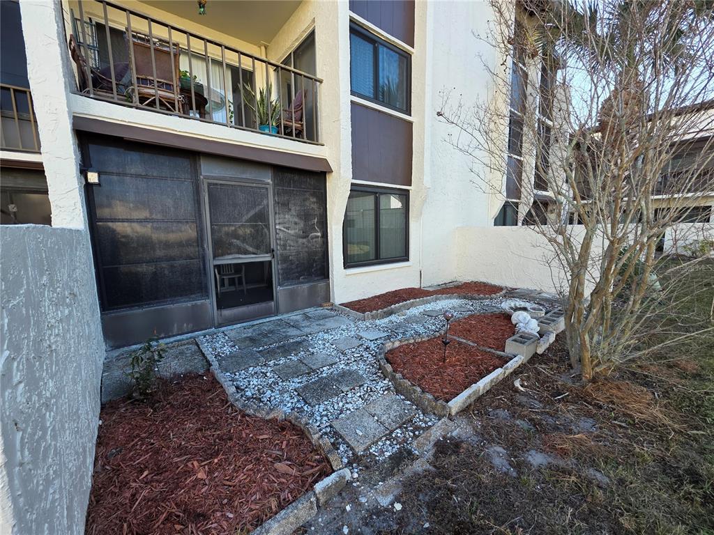 2207 Belleair Road, Unit B6 Clearwater, FL 33764 - Photo 13 of 21 a view of a house with a yard