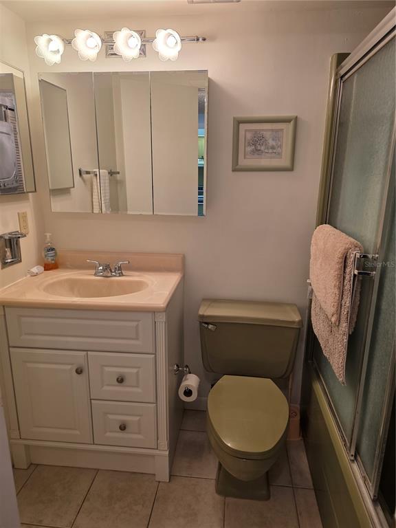 2207 Belleair Road, Unit B6 Clearwater, FL 33764 - Photo 14 of 21 a bathroom with a toilet sink vanity and mirror