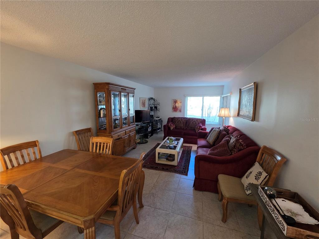 2207 Belleair Road, Unit B6 Clearwater, FL 33764 - Photo 3 of 21 a living room with furniture a rug and a window