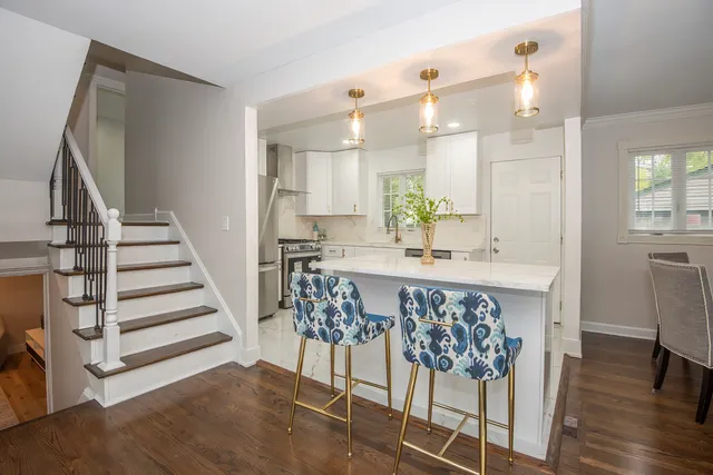 a view of kitchen with sink and wooden floor