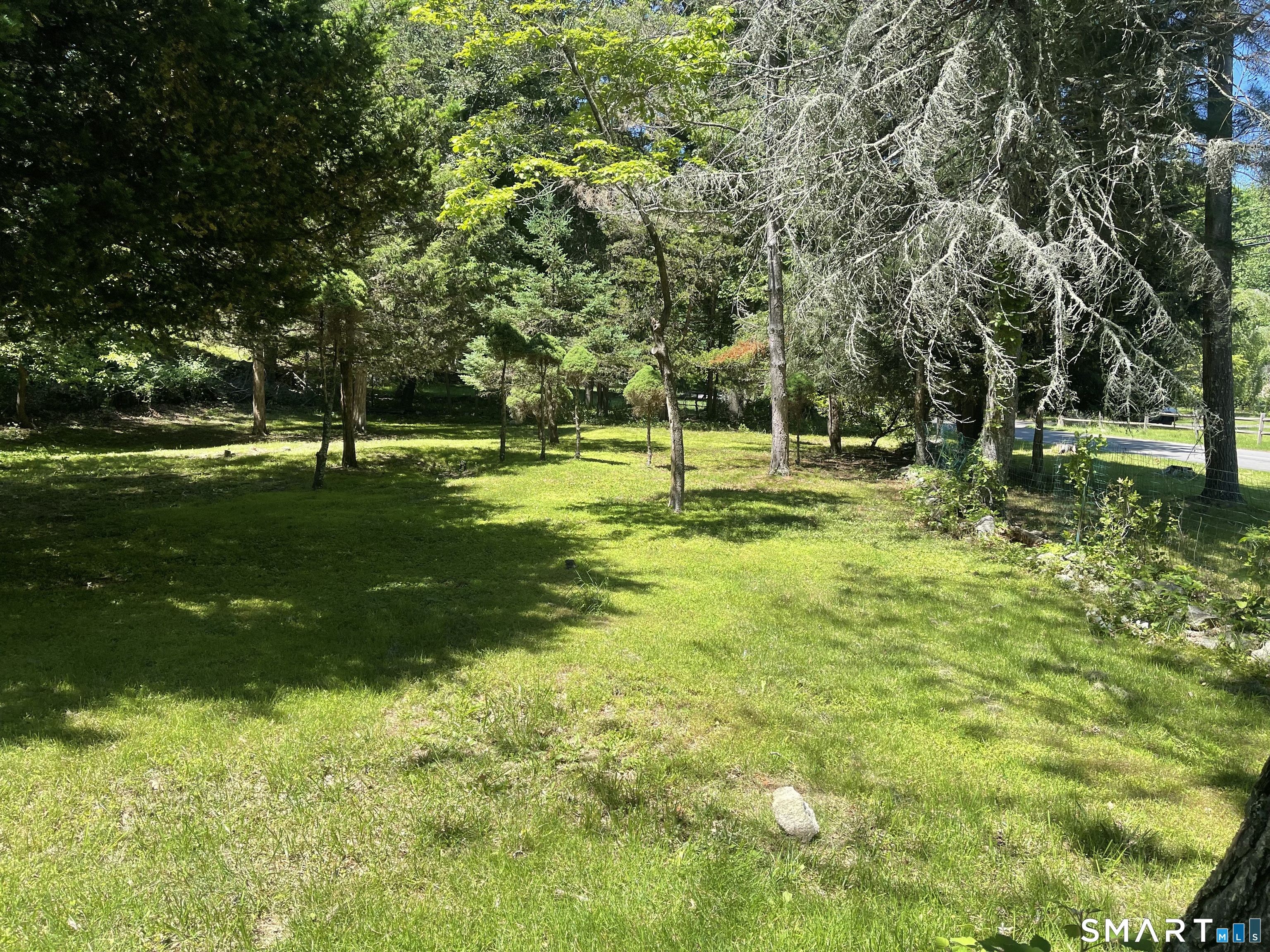 11 Tubbs Spring Drive Weston, CT 06883 - Photo 4 of 36 Large front lawn, much fenced for animals