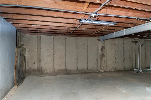 a view of a room with wooden walls