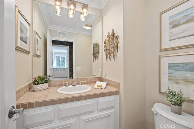 a bedroom with a bed mirror and a large window