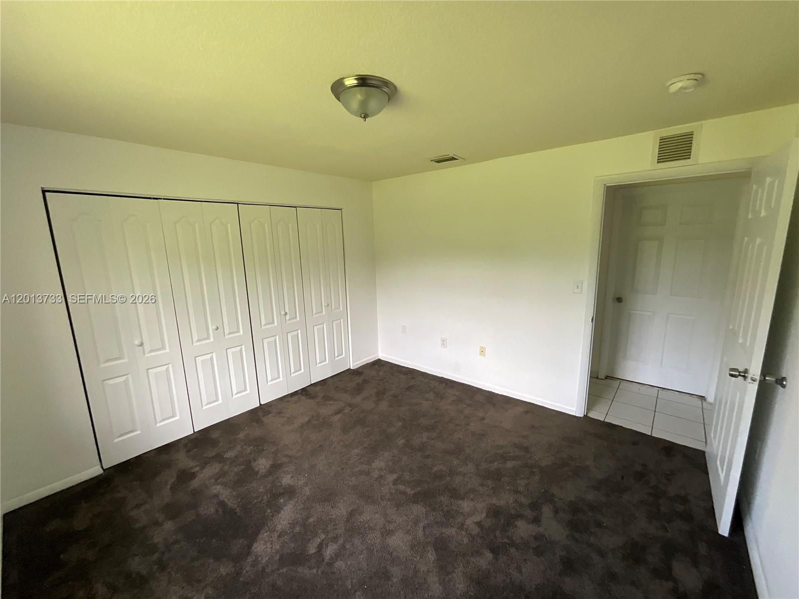 209 Northeast 141st Street, Unit 4 Miami, FL 33161 - Photo 10 of 13 a view of an empty room